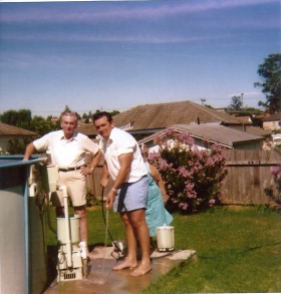 Doug and Dad fixing the pool - Summer 1975